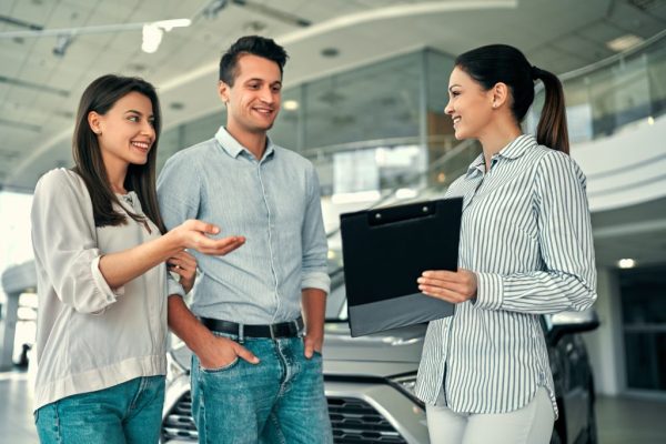 at-a-car-dealership-buying-a-car-e1696299387872-1024x683